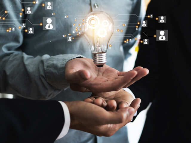 Innovation and idea of professional leader with teamwork holding lighting bulb with business icon and technology line, brainstorming teamwork and thinking management concept